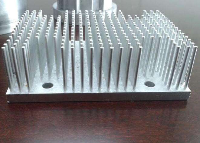 Cold forged pin fin heatsink